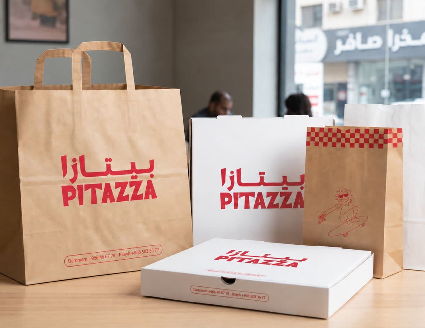 PITAZZA branded packaging and restaurant identity application showcasing takeaway materials and visual branding