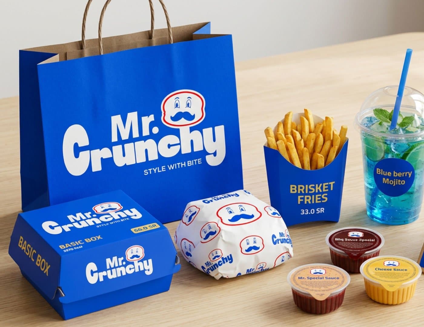 Mr. Crunchy brand presentation featuring branded packaging, food menu, burger, drinks, and blue visual identity.