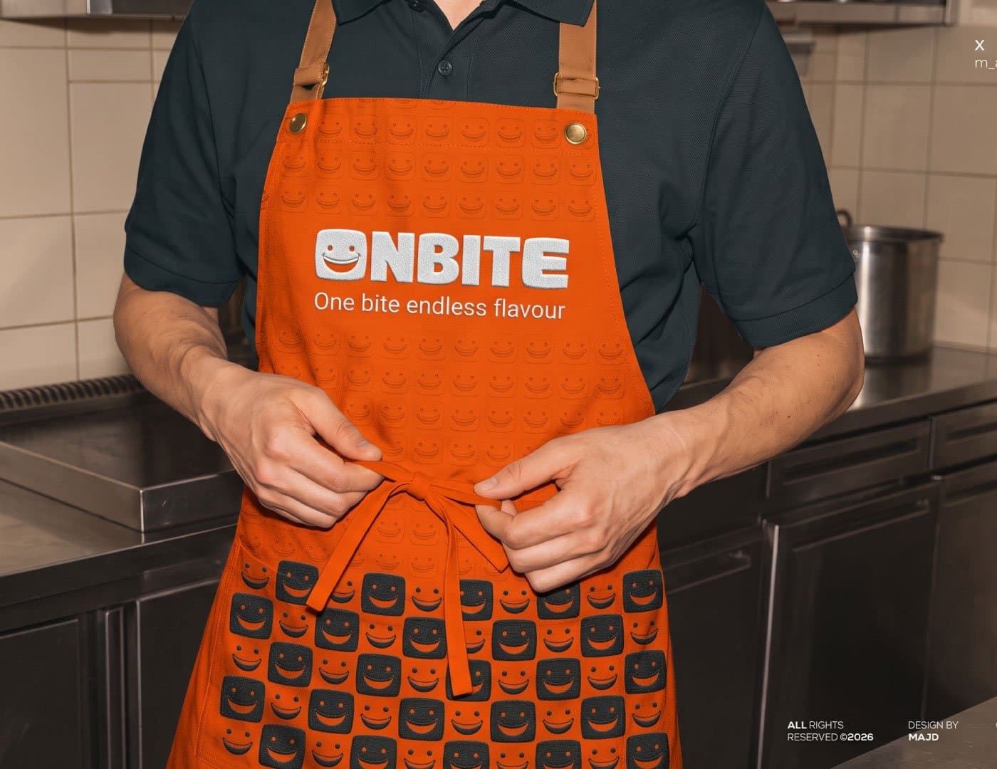 ONBITE branded orange cap featuring the signature smile logo, brand pattern, and tagline